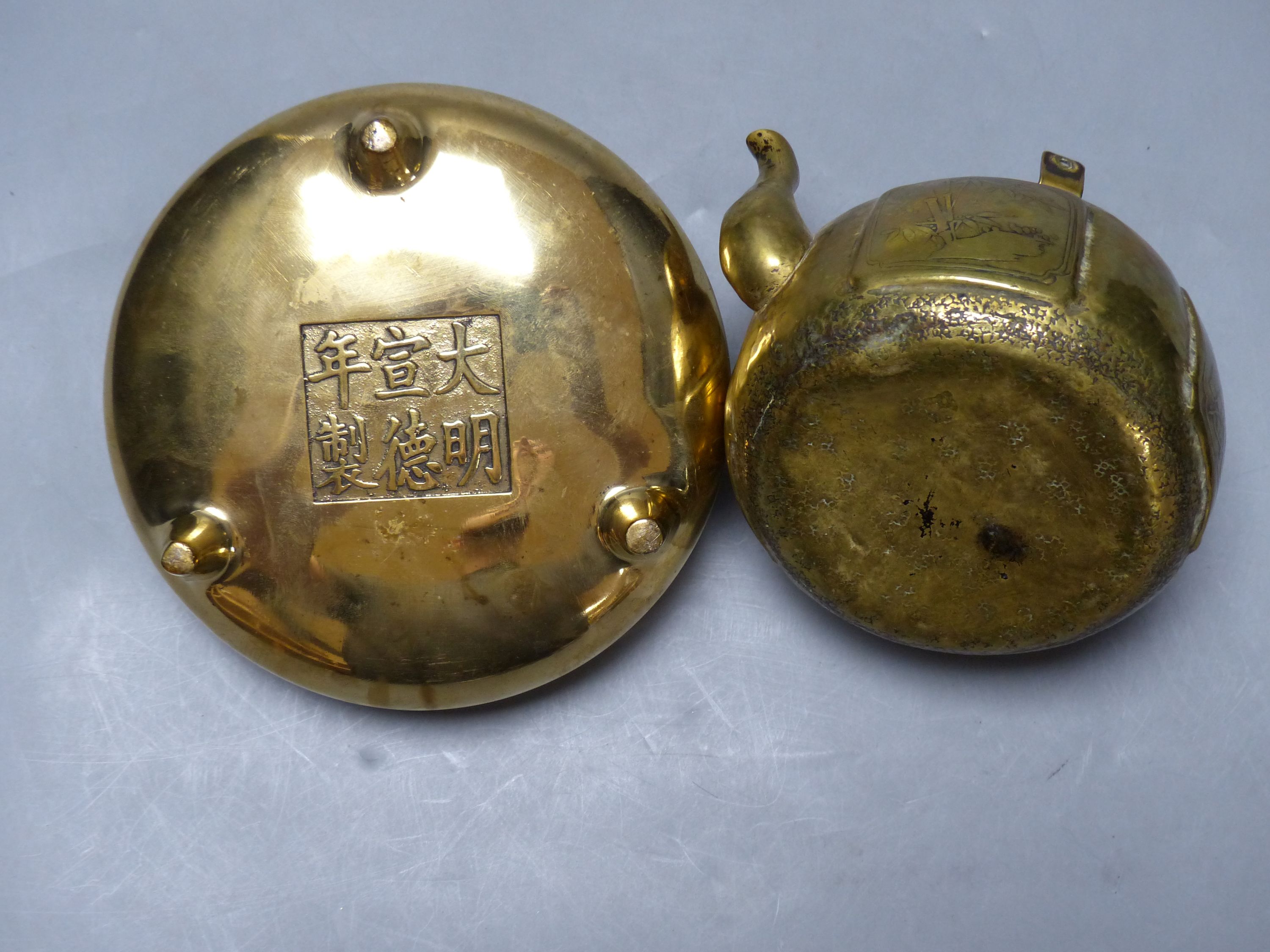 A Chinese bronze censor with Xuande mark, diameter 15cm, and a brass tea pot